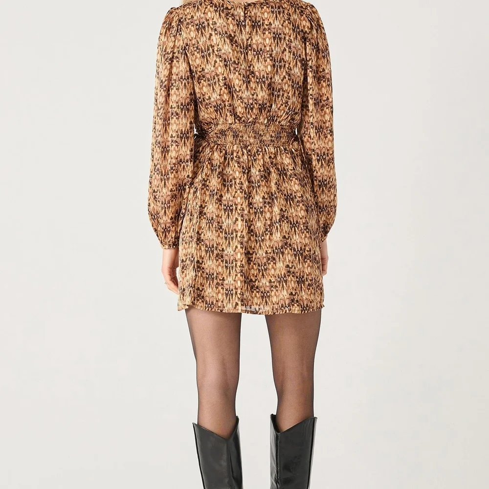 Black Tape_ Brown and Tan Patterned Garment